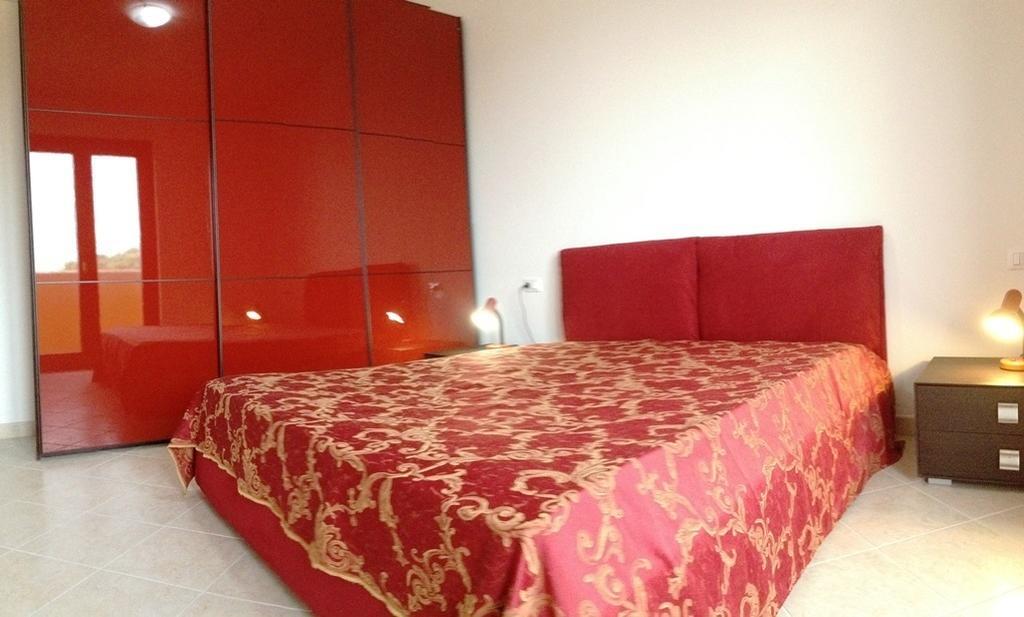 Regina Apartments Alghero Værelse billede